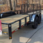 Side view of 6.5' by 14' tandem axle trailer, showcasing the benefits of the tandem axle for improved stability at Potter Storage in Morton, IL.